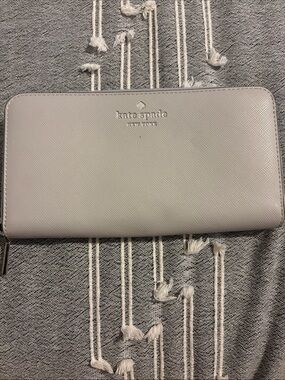 kate spade Light Gray Saffiano Zip Wallet with Silver Logo